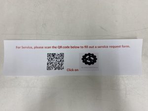 A photo of a qr code that goes to a service request form